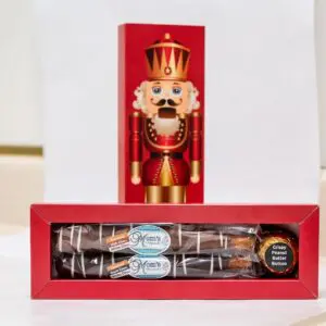 A nutcracker is shown in a box on the table.