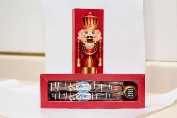 A nutcracker is shown in a box on the table.