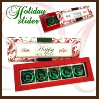 A holiday slider box with five chocolates in it.